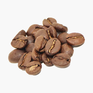 A small pile of coffee beans brown in colour from roasting, on a white background.